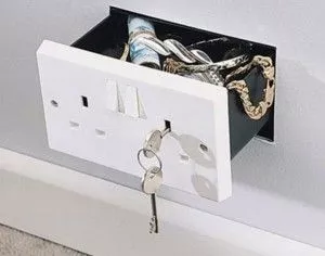 Here's a secret compartment concealed as an INTL style electrical wall outlet.