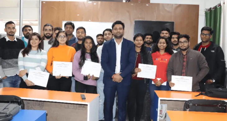Students holding certificates after completing a digital marketing training session at DSOM in Dehradun