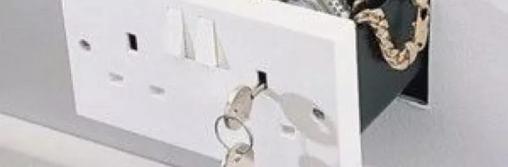 Here's a secret compartment concealed as an INTL style electrical wall outlet.