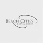 Beach Cities Dental Group logo featuring the words “Beach Cities” above “Dental Group,” surrounded by a stylized gray oval swoosh on a light gray background.