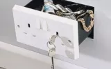 Here's a secret compartment concealed as an INTL style electrical wall outlet.