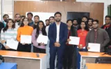 Students holding certificates after completing a digital marketing training session at DSOM in Dehradun