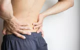 man-holding-his-back