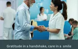 Nurse shaking hand with an elderly person